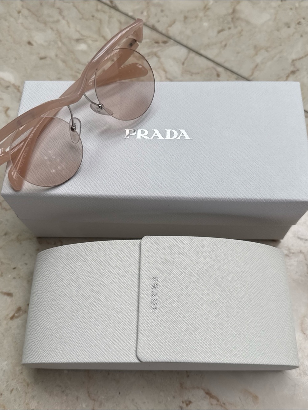 Prada Rimless Sunglasses in Peach/ Blush Pink
